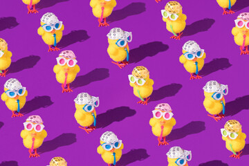 Minimal Easter pattern background with party chicken with hat, tie and glasses. Creative party or holiday concept.