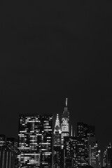 Fototapeta na wymiar Dark Black and White Nighttime Midtown Manhattan Skyline in New York City