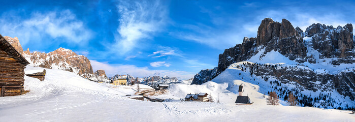 Panorama of Wolkenstein in Gröden in winter with view to the pizes de cir, Grödner Joch and the...