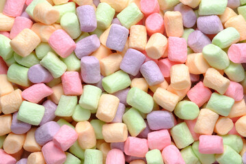 Sweets closeup. Background or texture of colorful mini marshmallows.