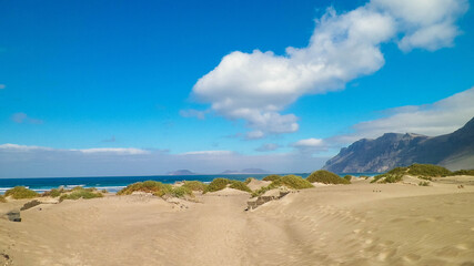 Beach and mountains - beautiful coast in Caleta de Famara, Lanzarote Canary Islands.