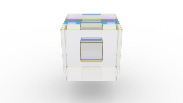 One glass cube rotates inside another, which moves up and down on a white background. Seamless loop.