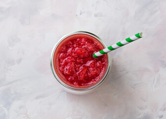 Red orange juice in a glass. Cocktail from Sicilian oranges. Creative minimal summer idea.
