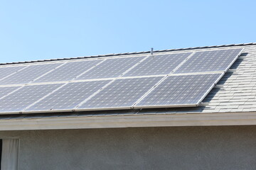 Solar Panels on a Residential House making Photovoltaic Electricity From the Sun