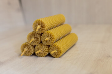 Handmade wax candles, wooden background