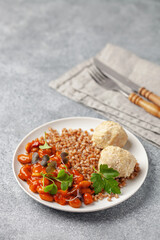 Meatballs with buckwheat porridge and beans in tomato. Diet nutrition