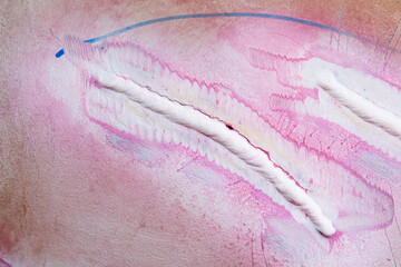 The cracks and the weld. Longitudinal cracks they are parallel to the weld in the  the heat affected zone. White weld caused by Penetrant Testing.