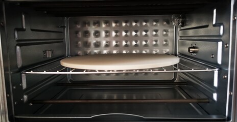 Empty oven with ceramic stone for baking pizza