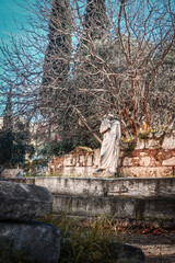 Headless statue on wall of ancient classical Agora of Athens-the center of everyday life in ancient Athens &ndash; a place for commerce politics and community