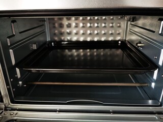 Empty oven with baking tray