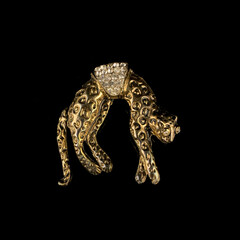 Panther-shaped gold jewelry with crystals. vintage brooch in the shape of a cat