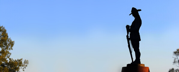 Silhouette of Anzac monument The monument is a World War One Digger standing guard. Alan Somerville artist. Remembrance Day - Anzac Day