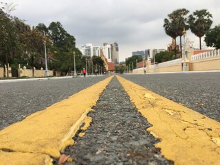 Quiet road in the capital city of Phnom Penh. Low angle shot.