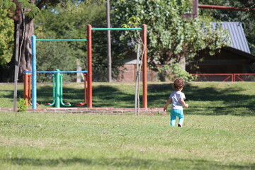 little child playing on the playground