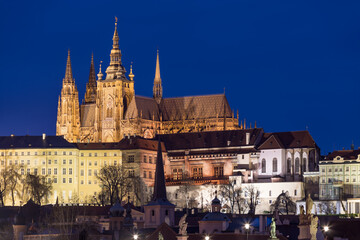 Fototapeta na wymiar Scenic view on Prague Castle and the St. Vitus cathedral and historical center of Prague, buildings and landmarks of old town at sunrise or dusk, Prague, Czech Republic. Beautiful and romantic evening