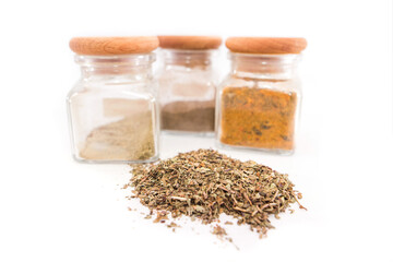 spices in jars on a white