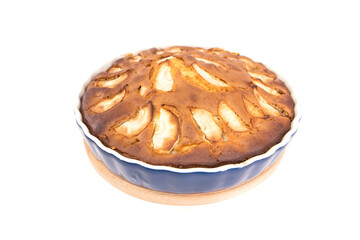 Freshly baked charlotte with apples on a white