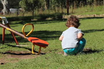 child playing on the grass