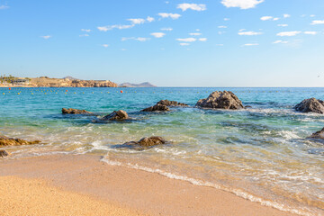 Playa el Chileno Beach, Cabo San Lucas, Mexico. Different stages of the fantastic ocean waves. Rocky and sandy beach.