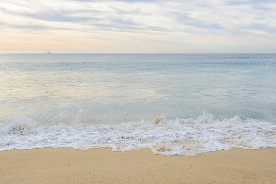 Set of six pictures of a fantastic ocean wave in different stages. Cloudy sunrise sky. San Jose del Cabo. Mexico.
