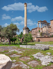 Rome Italy, column of Foca and Saturn temple under impressive sky in the Roman Forum