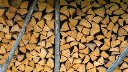 Firewood outside in a barn