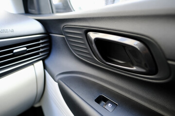 Fototapeta na wymiar Interior door handle detail of a modern car