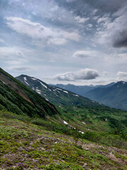 Fototapeta premium Kamchatka Mountains. Mountains covered with grass. The volcanic ring.