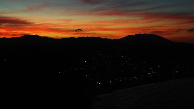 Aerial view of people paragliding at careca hill, Balne&aacute;rio Cambori&uacute;, Brazil.