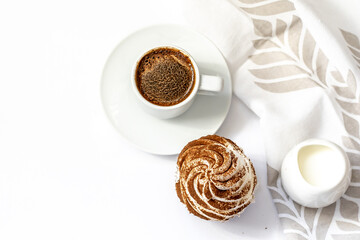 Dark chocolate and cocoa chocolate cupcakes with a cup of hot black coffee. Space for text
