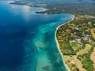 Tropical Lombok island with beach and turquoise ocean, aerial view.