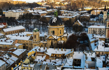 winter panorama of the European town with old basilica and towers 