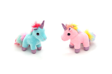 Two unicorn plush toys. Isolated on white background