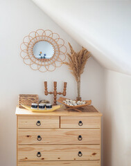 Mid-century modern objects in a modern interior with a wooden chest of drawers