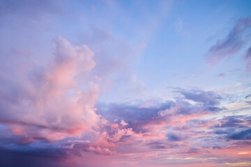 The rose of sunset. Beautiful pink clouds on the blue sunset sky