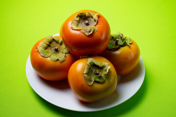 persimmon fruit on a plate