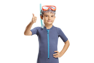 Boy in a wetsuit with a diving mask and flippers and showing thumbs up