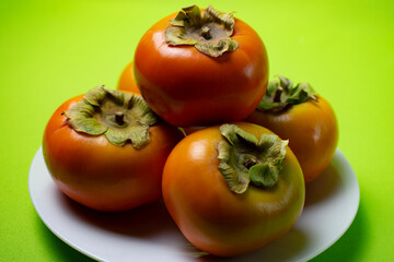 persimmon fruit on a plate