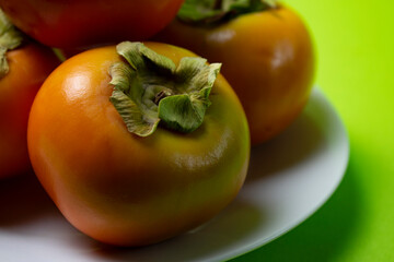 persimmon fruit on a plate