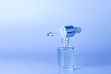 Glass white and yellow. bottles for oil, lotion, cream orange background. Natural cosmetics. Layout of the beauty salon branding.