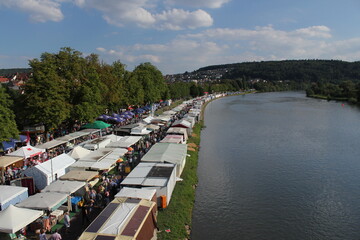 Fototapeta na wymiar riverside of the main in marktheidenfeld during laurenzi fair in summer