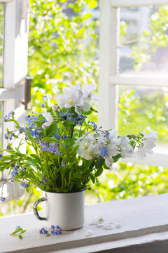 Bouquet of spring flowers on windowsill