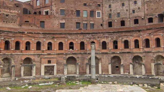 A panoramic view on Trajan's Market timelapse hyperlapse (Mercati Traianei) on the Via dei Fori Imperiali, in Rome, Italy. Cloudy sky