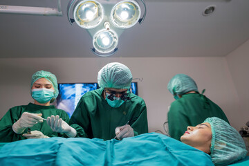 Fototapeta na wymiar Surgeon team working in operating room