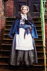 Young woman in vintage dress late 19th century 