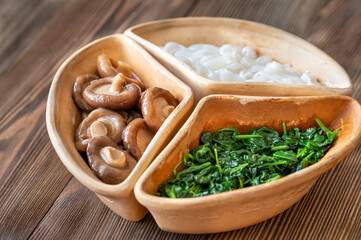 Bowl with rice noodles, mushrooms and spinach