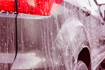 Car wash foam is applied to the car.