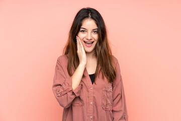 Young caucasian woman isolated on pink background with surprise and shocked facial expression