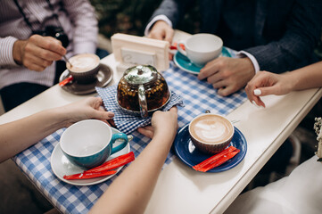 coffee in cups, latte, cappuccino, sugar bowl, table set for lunch in a cafe