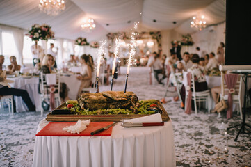 taking out meat dishes in a restaurant with fire